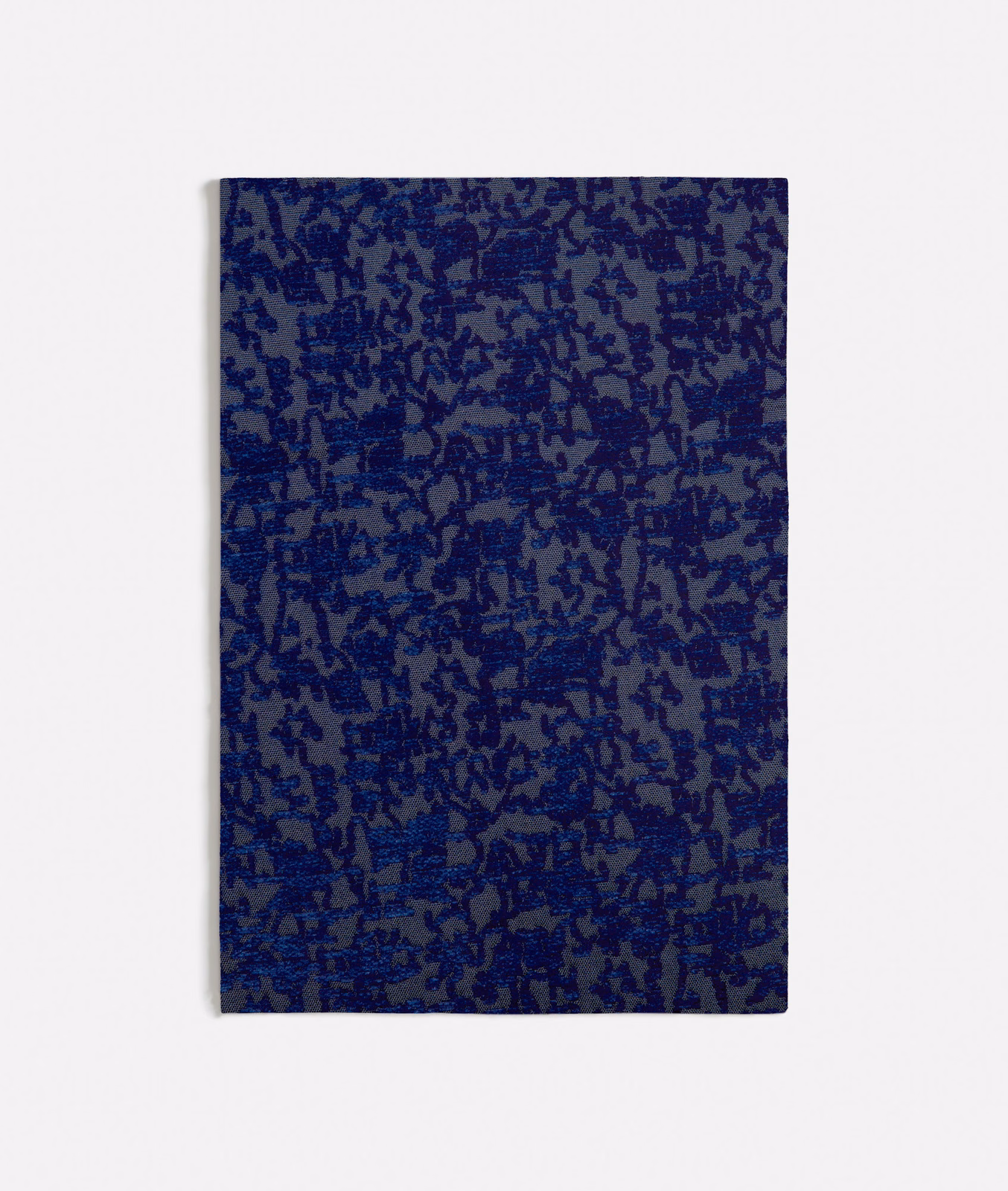 Deep ink-blue swatch with dense irregular botanical marks and a tactile woven ground