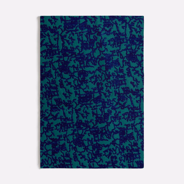 Seafoam teal fabric swatch covered in dense irregular navy botanical marks
