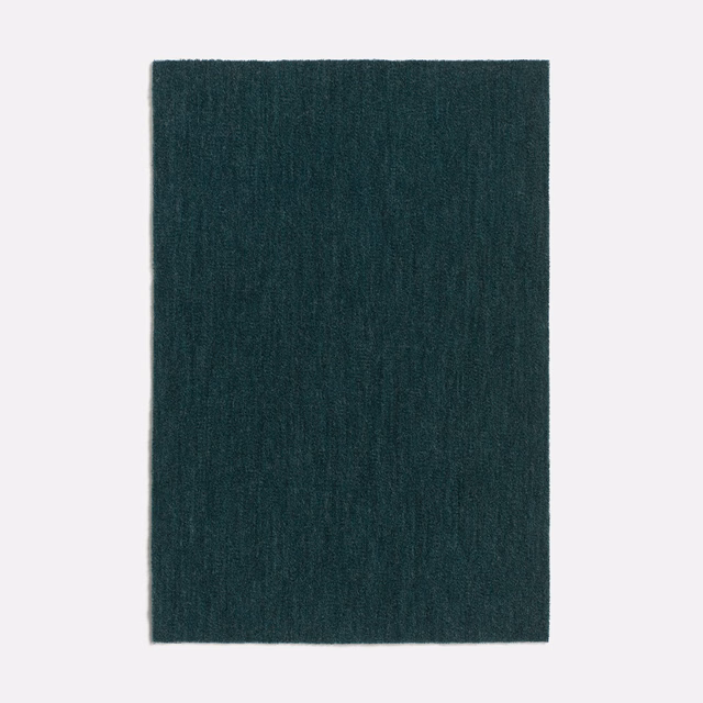 Deep forest-green velvet swatch with subtle vertical nap variation and a blue-green undertone