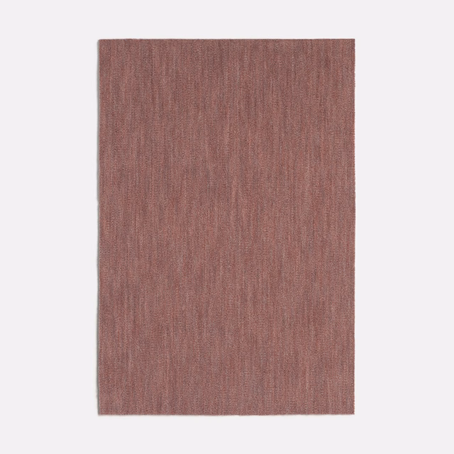 Dusty rose pink velvet swatch with fine vertical striations and subtle tonal depth