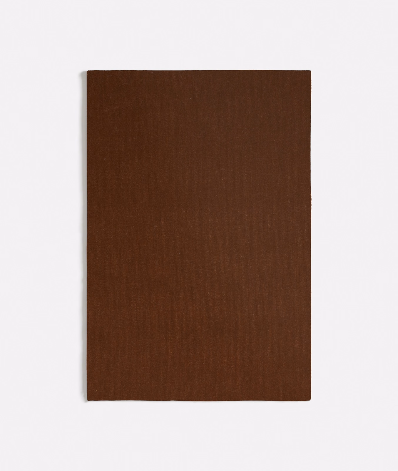 Deep spice-brown velvet swatch showing a smooth, subtly directional pile