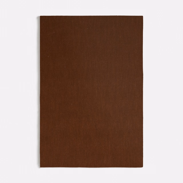 Deep spice-brown velvet swatch showing a smooth, subtly directional pile