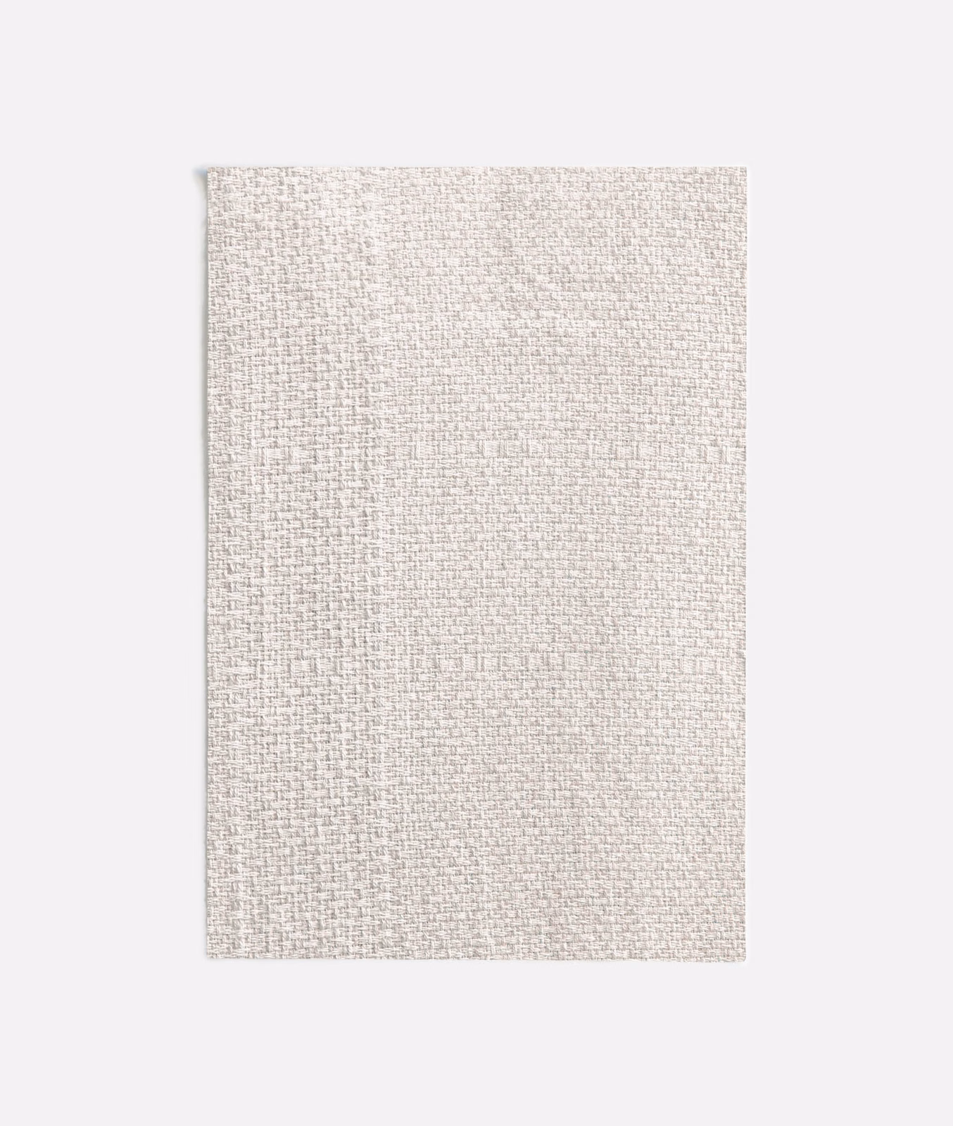 Close view of Calaluna Off White’s pale woven crosshatch texture