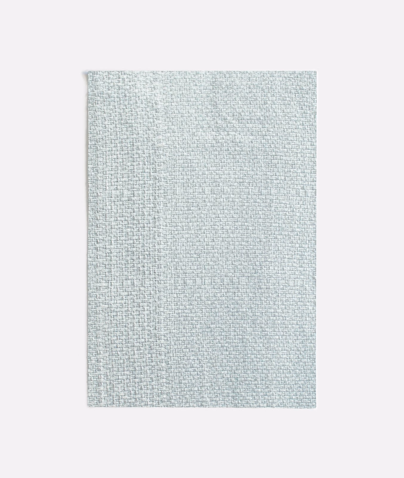 Pale seafoam woven textile with a fine, softly crosshatched surface