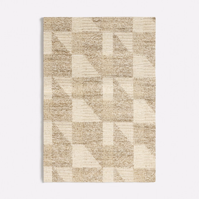 Warm ivory and taupe woven fabric with repeating geometric blocks and triangles