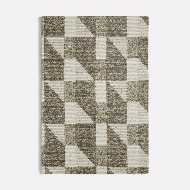 Muted sage green and cream geometric fabric with a softly flecked woven texture
