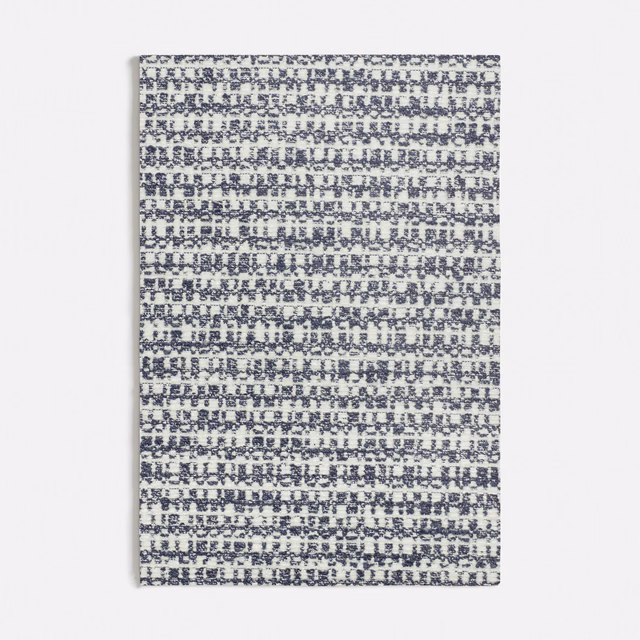 Muted blue-grey woven swatch with broken horizontal rows and flecked texture