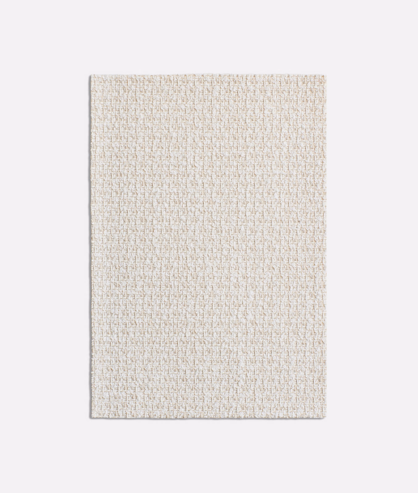 Pale oatmeal beige textile with fine peppered weave and soft tonal flecks
