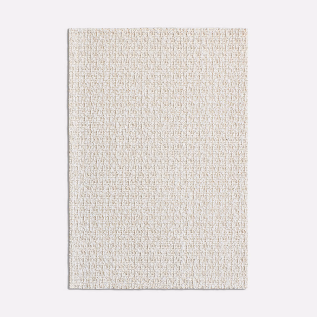Pale oatmeal beige textile with fine peppered weave and soft tonal flecks