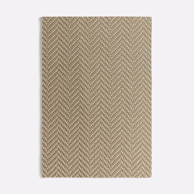 Warm taupe fabric swatch with a fine diagonal herringbone weave and subtle texture