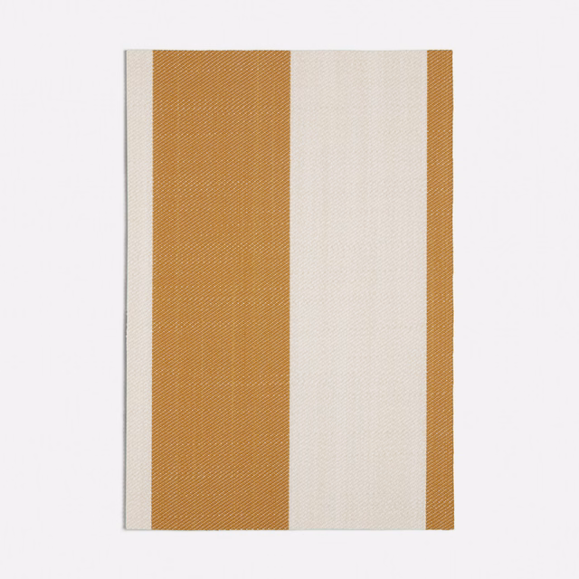 Close view of Chemin Yellow's broad ochre and ivory woven stripes
