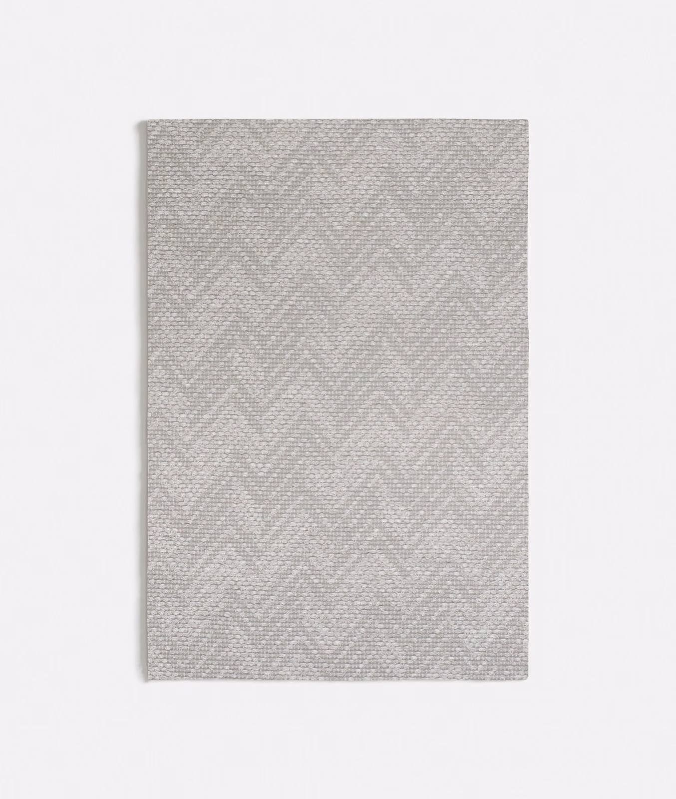 Pale cool grey fabric swatch with fine woven chevron texture