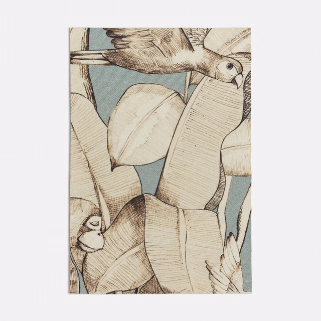 Cool seafoam fabric with cream leaves, brown linework and a perched bird