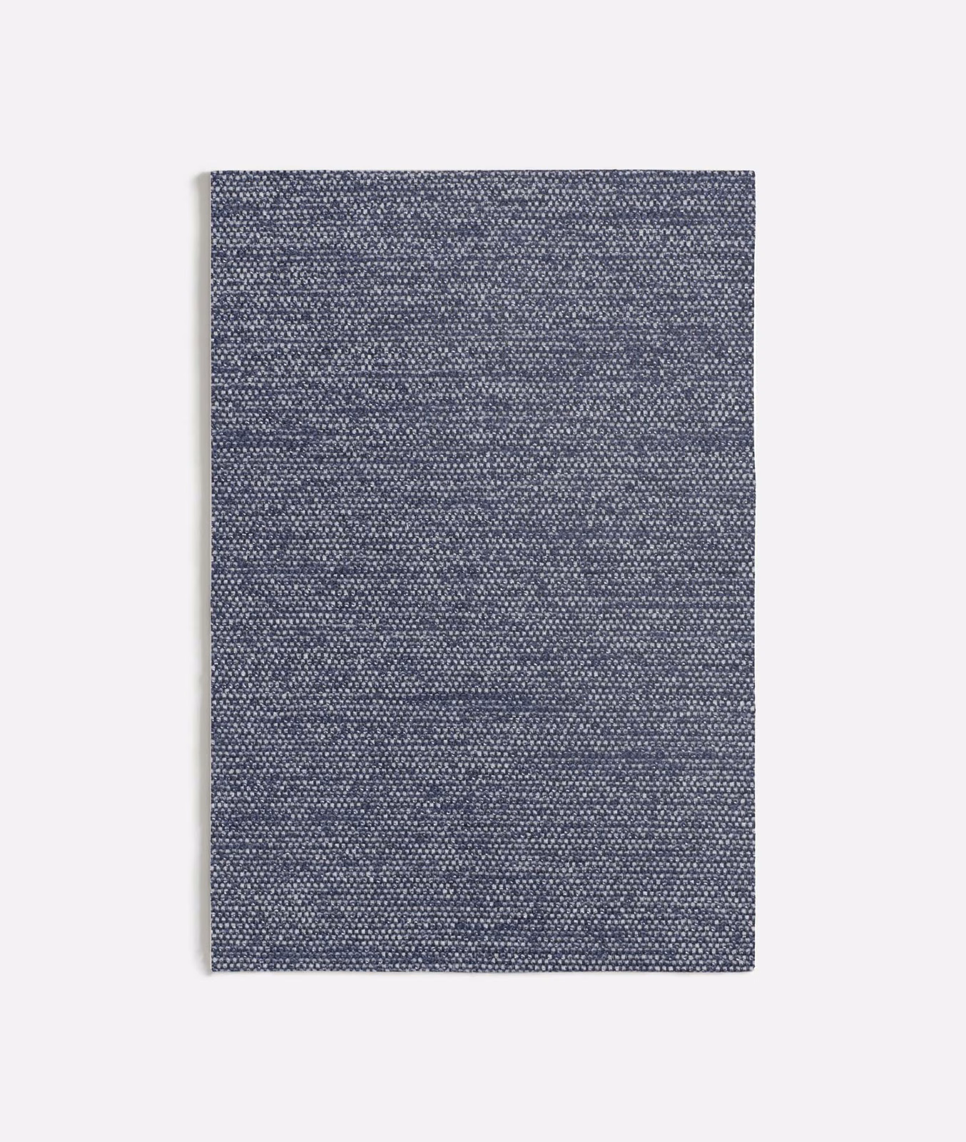 Muted blue-grey Corbello swatch showing a compact, subtly mottled woven texture