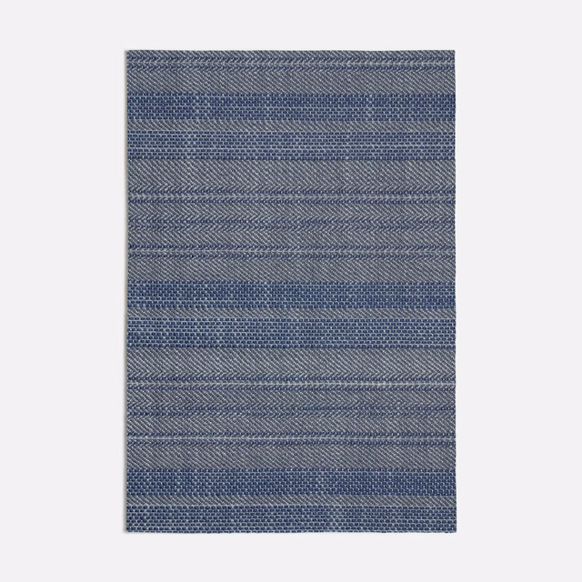 Cool blue-grey woven swatch with fine horizontal bands and chevron-like texture
