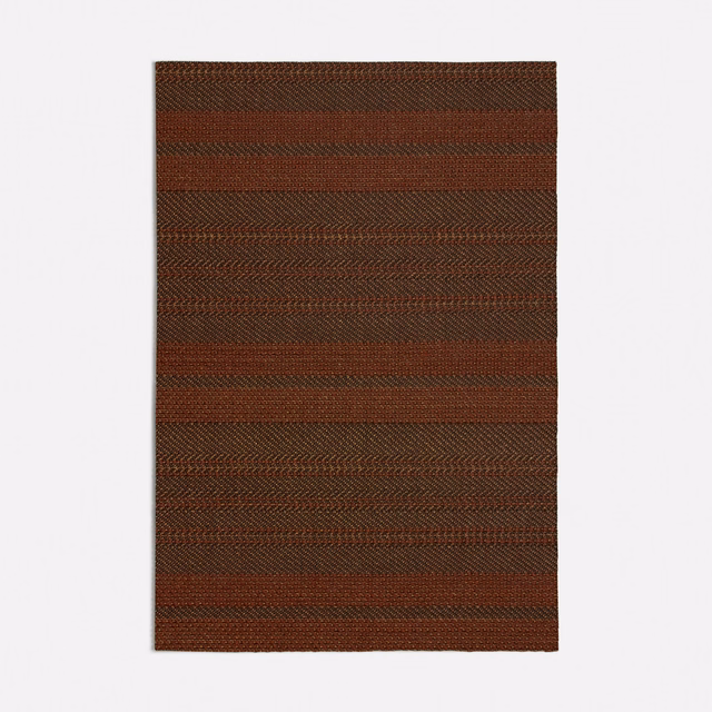 Deep terracotta and brown woven textile with horizontal bands and chevron texture