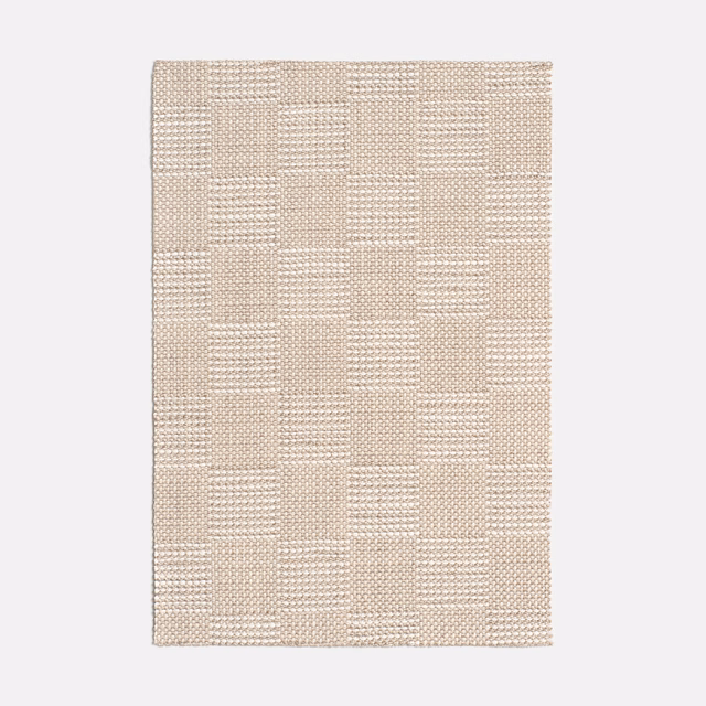 Pale linen-beige woven fabric with a raised, irregular block-check texture