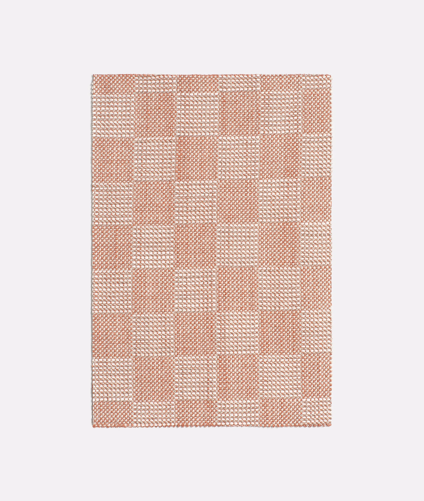 Muted terracotta and cream checked textile with a tactile woven surface