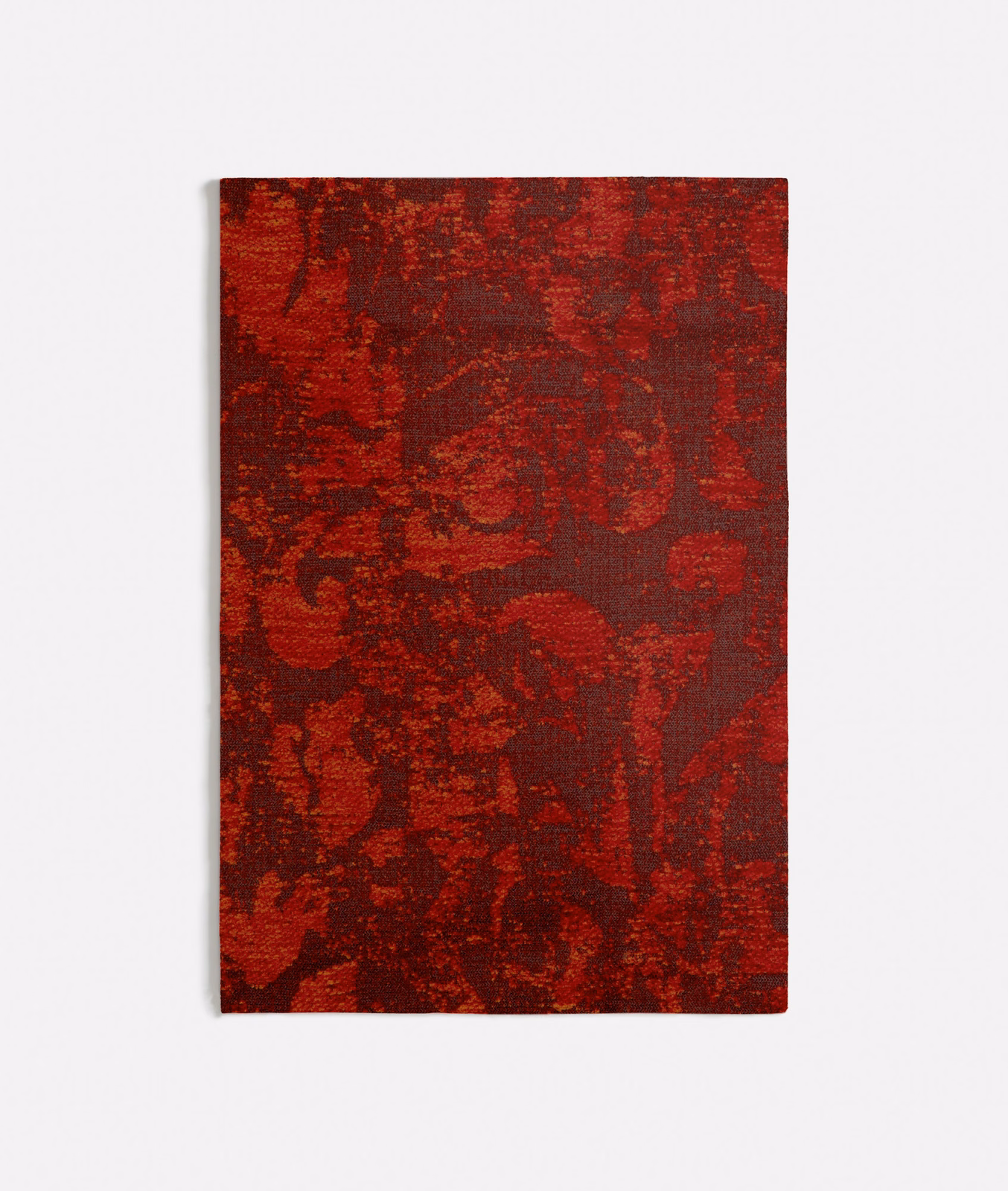 Burnt orange and burgundy abstract woven textile with dark painterly blocks