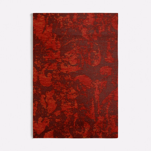 Burnt orange and burgundy abstract woven textile with dark painterly blocks