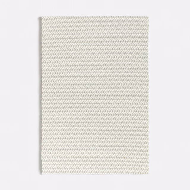 Pale warm-grey Elicriso textile showing a fine, tightly packed micro-weave
