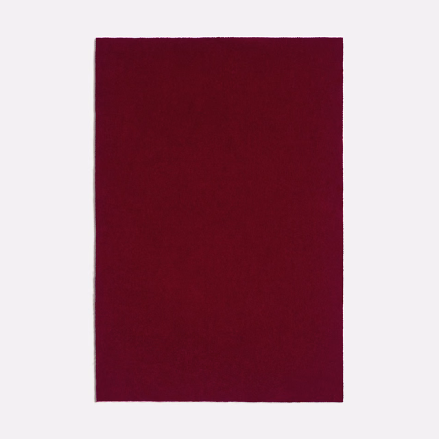 Deep Bordeaux textile swatch with a plain, subtly textured matte surface