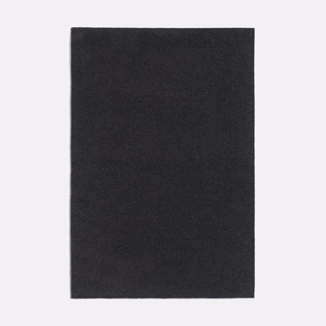 Deep charcoal-grey plain textile with a softly mottled, matte surface