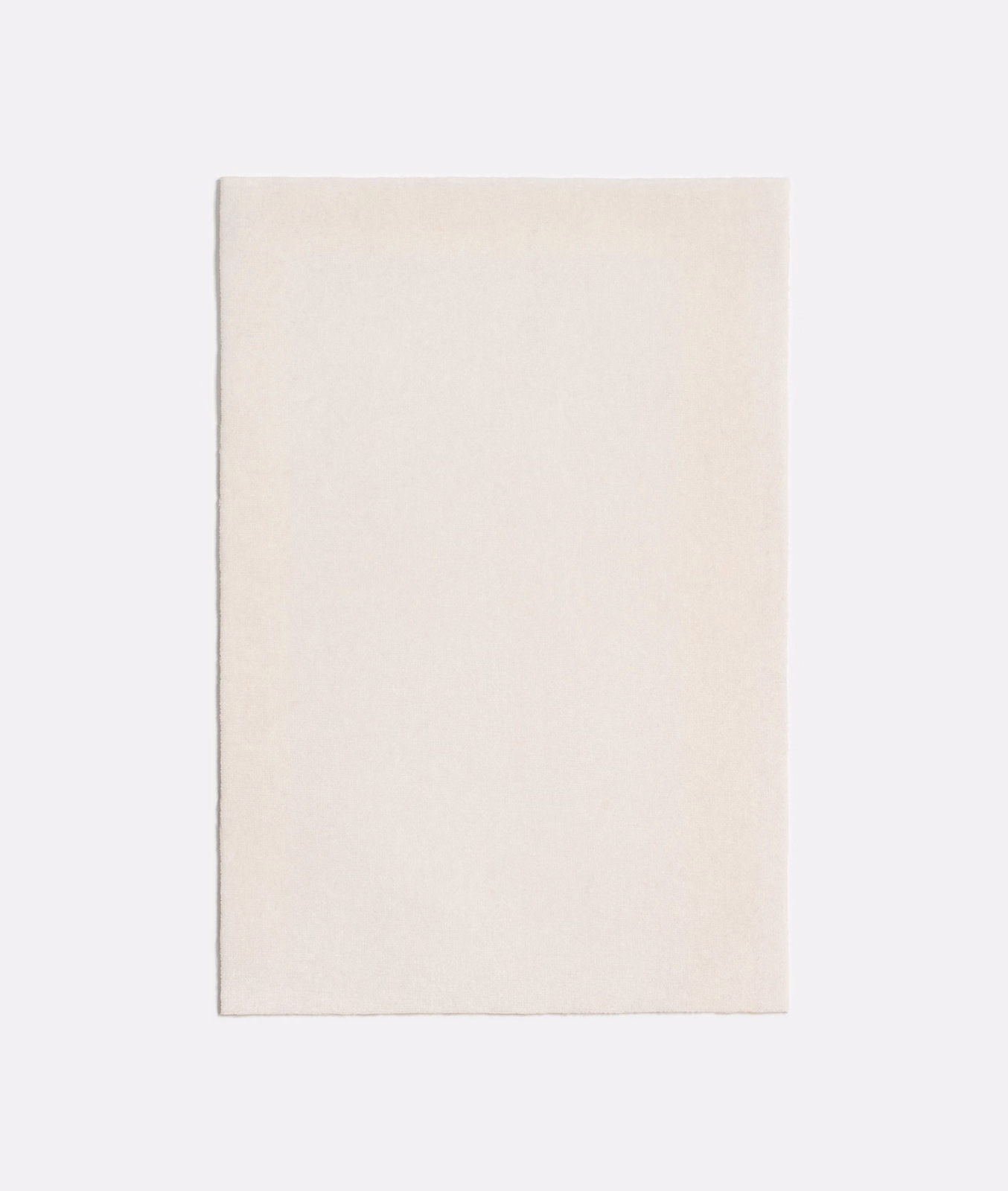 Warm off-white fabric swatch with a fine, subtly textured surface