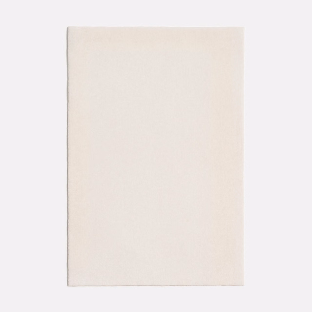 Warm off-white fabric swatch with a fine, subtly textured surface
