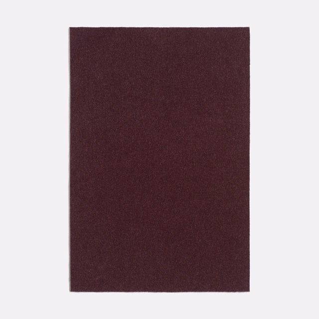Deep aubergine-purple plain fabric swatch with a subtle matte woven grain