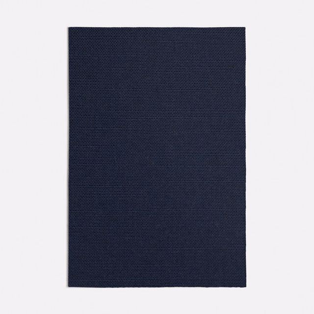 Deep ink navy fabric swatch with a compact, subtly tonal woven texture