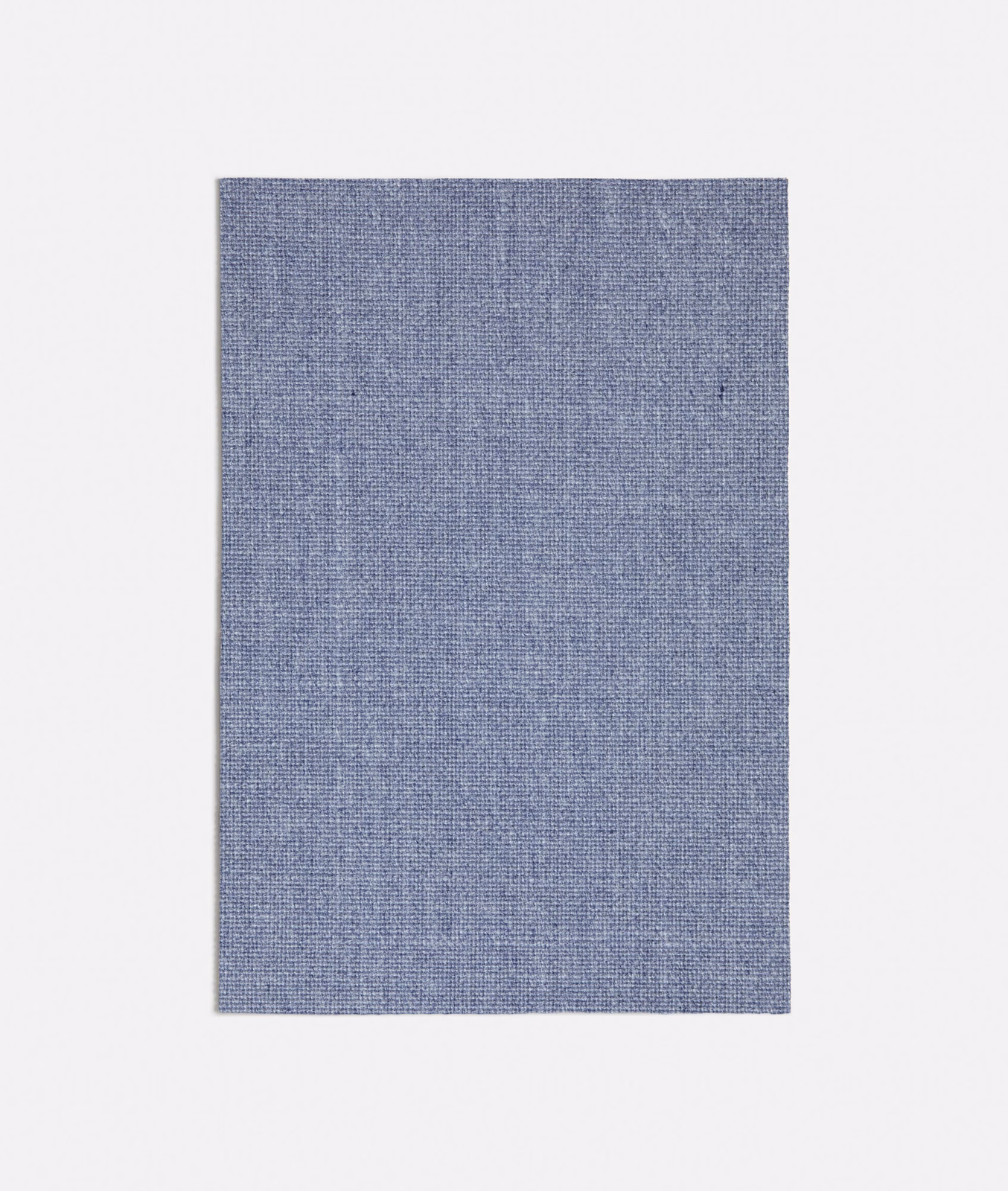 Close-up of muted blue-grey Erfoud fabric with a fine plain woven texture