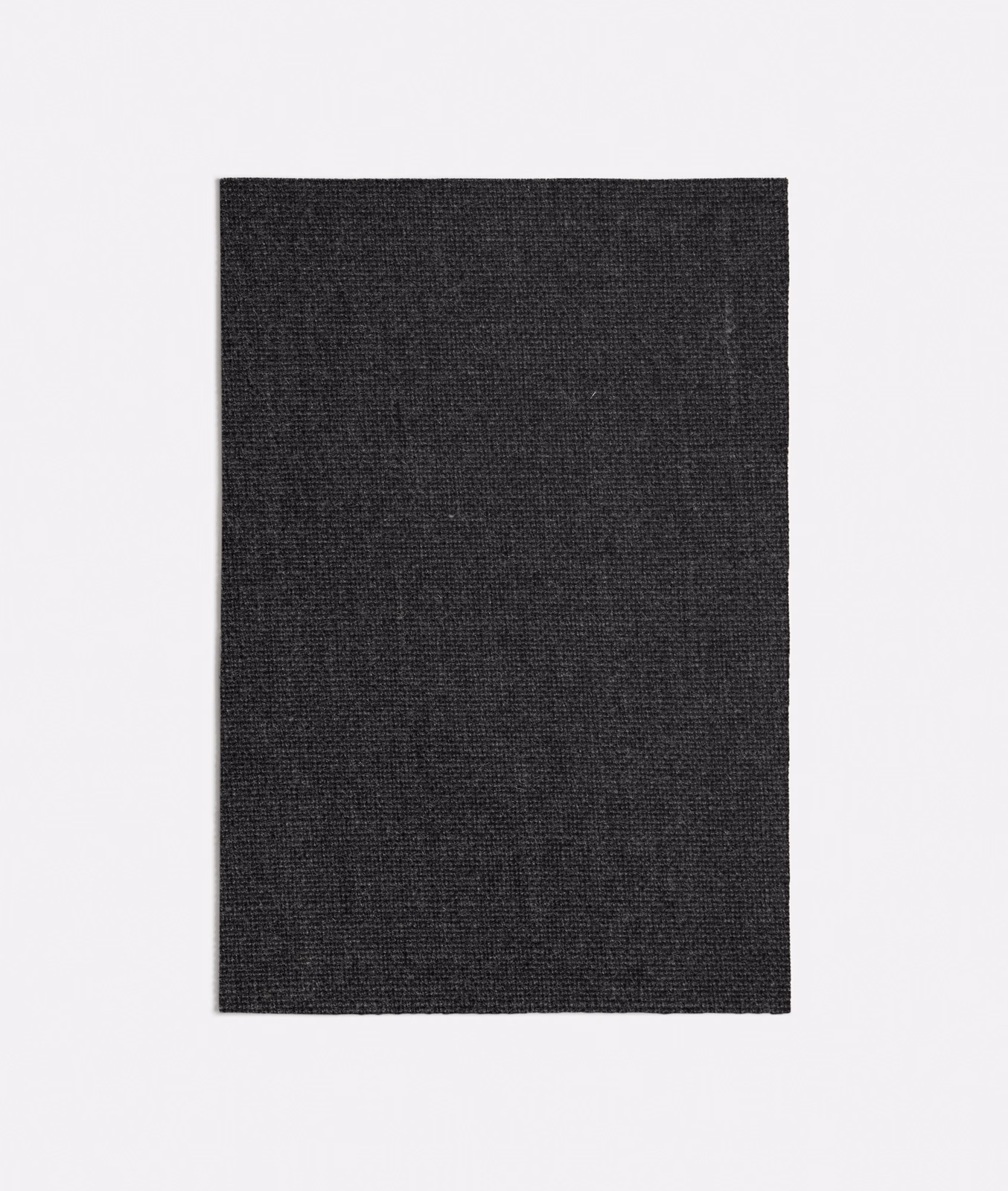 Dark charcoal grey fabric swatch showing a fine, tightly woven surface with subtle tonal depth