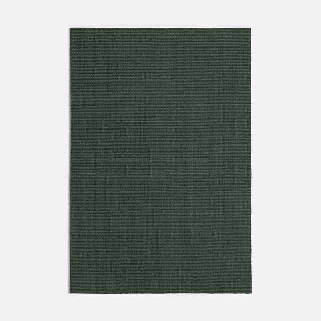 Close view of deep forest green fabric with a fine tonal woven texture
