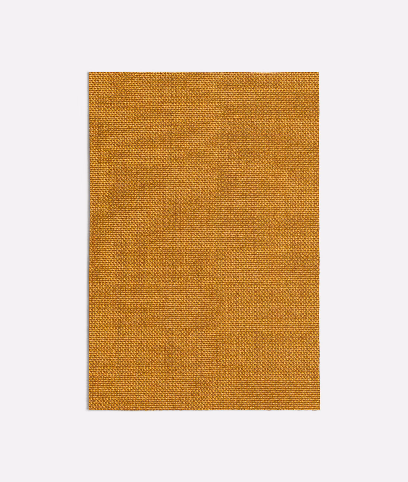 Close-up of warm ochre-orange fabric with a fine, dense woven texture