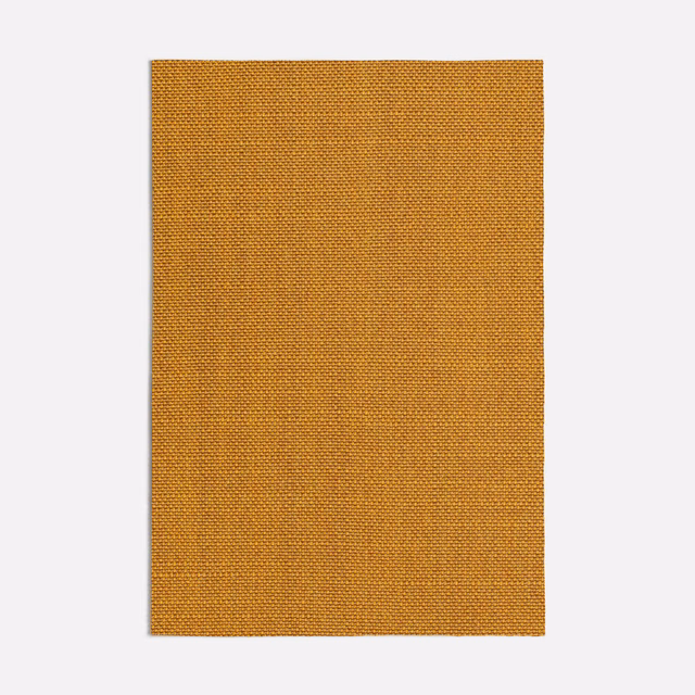 Close-up of warm ochre-orange fabric with a fine, dense woven texture