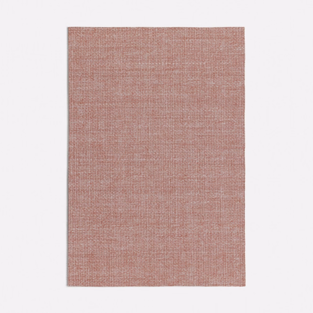 Muted dusty pink fabric with a fine, close crosshatched woven texture
