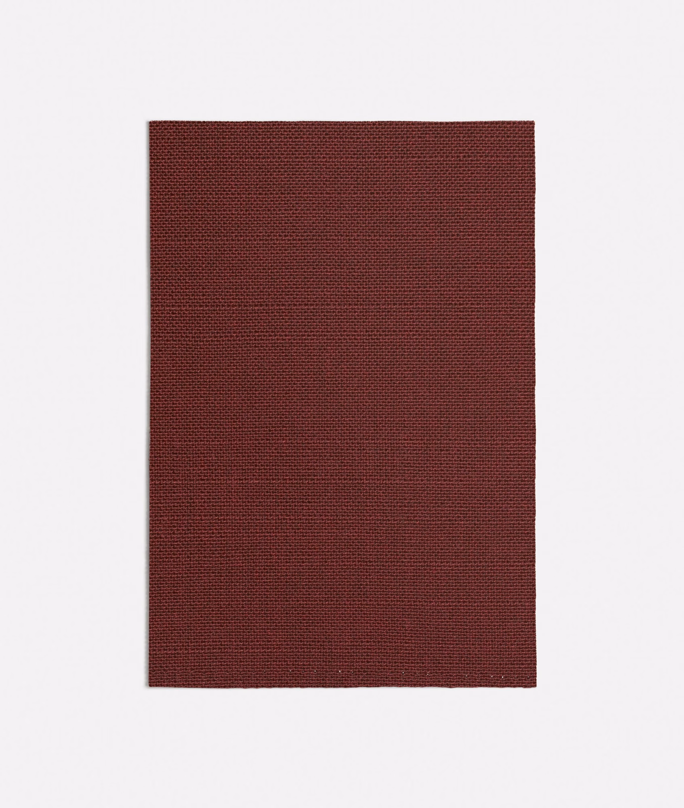 Deep oxblood red fabric swatch showing a fine, tightly woven textured surface