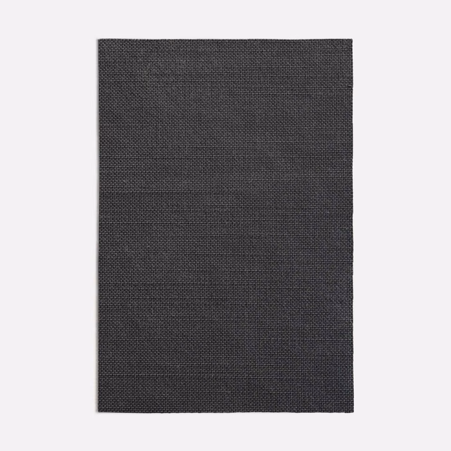 Close-up of dark charcoal-grey fabric with a fine, tightly packed woven grid