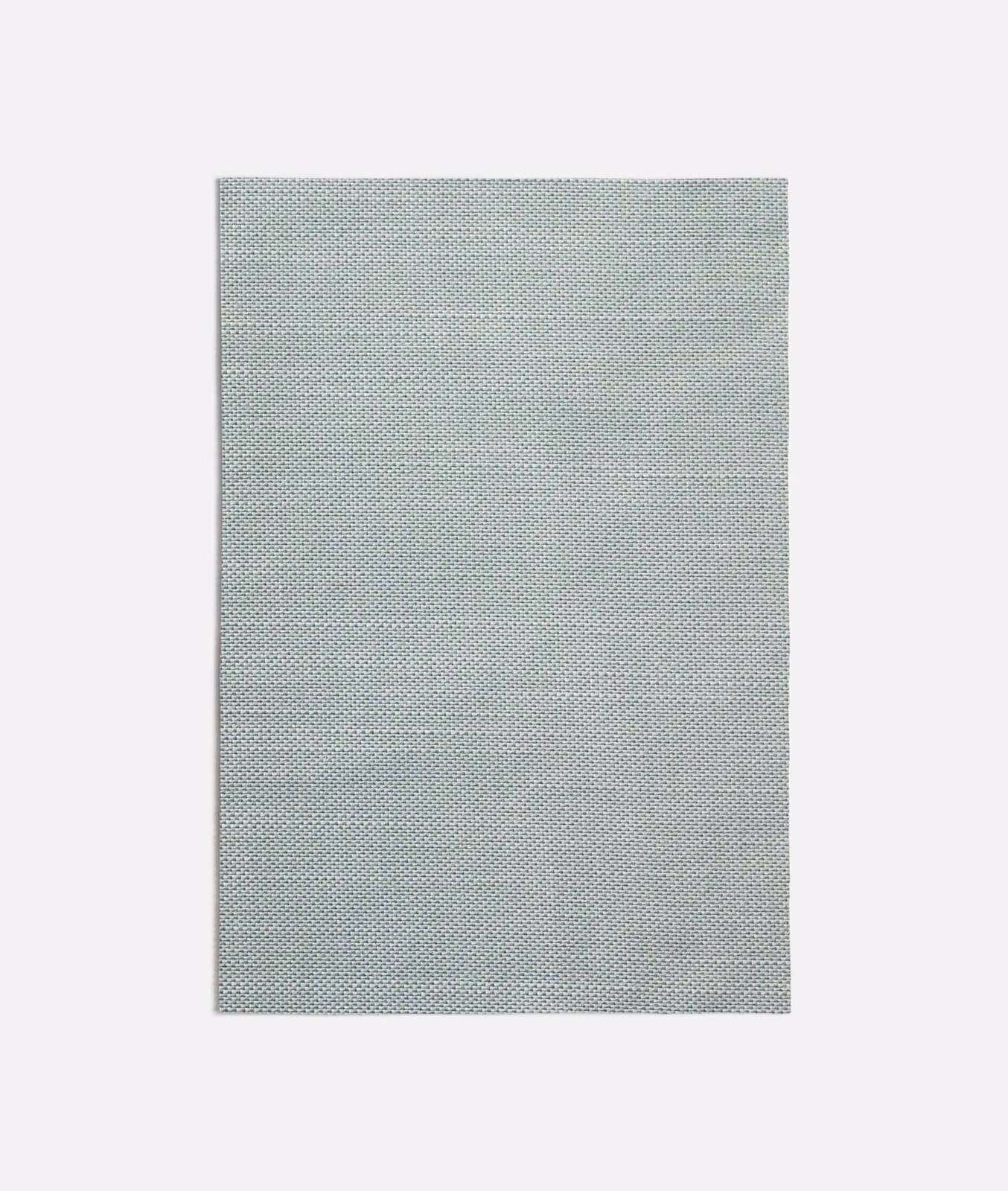 Pale seafoam fabric with a fine, dark-flecked woven texture