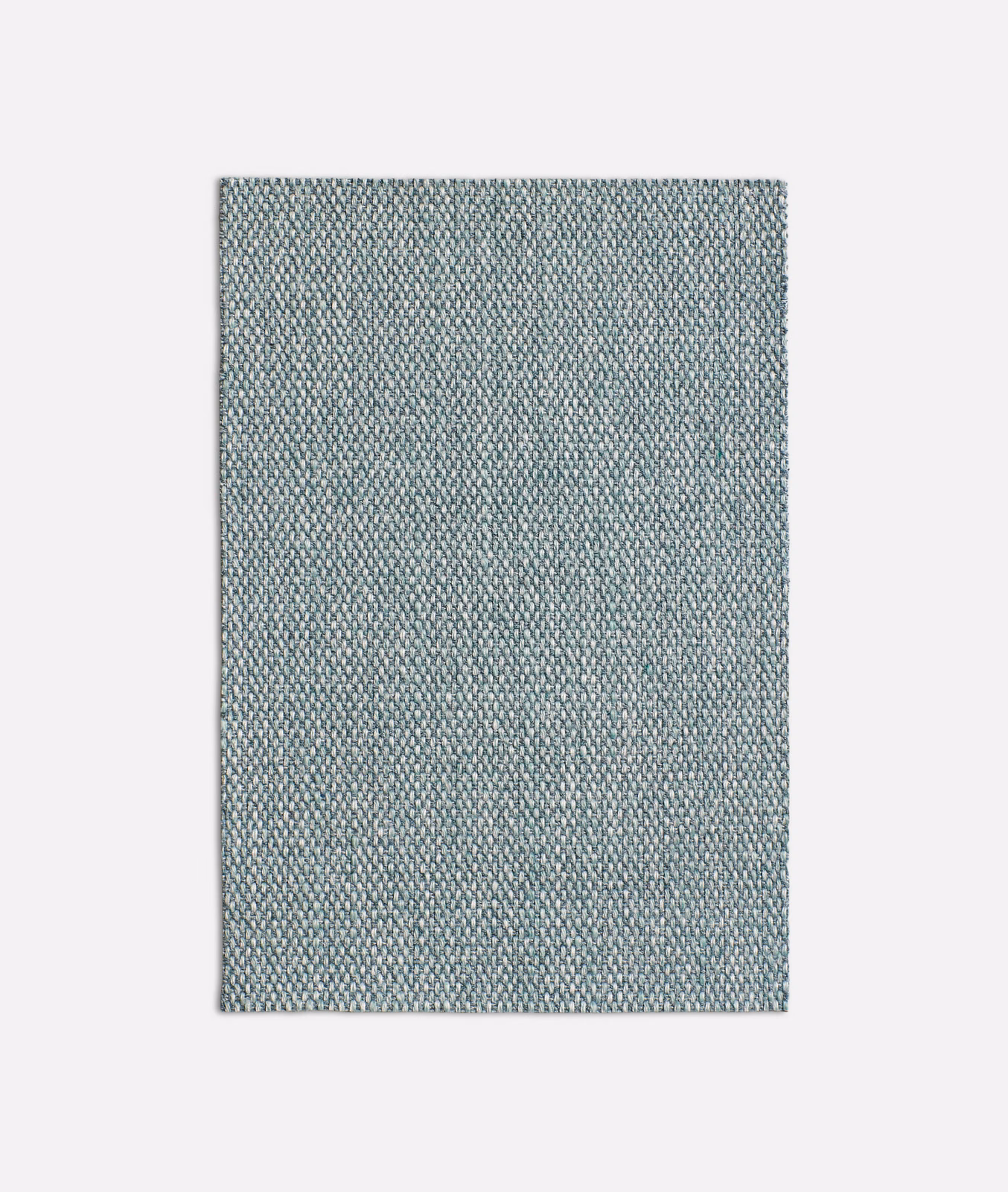 Close-up of cool seafoam green fabric with a dense, pebbled woven texture
