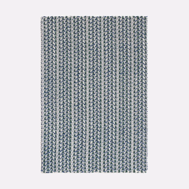Cool blue-grey Filigrana textile with a small pale interlocking geometric weave