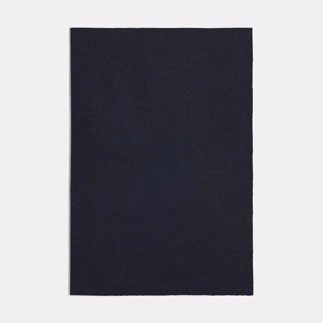 Near-black navy blue fabric swatch with a fine, subtly diagonal weave
