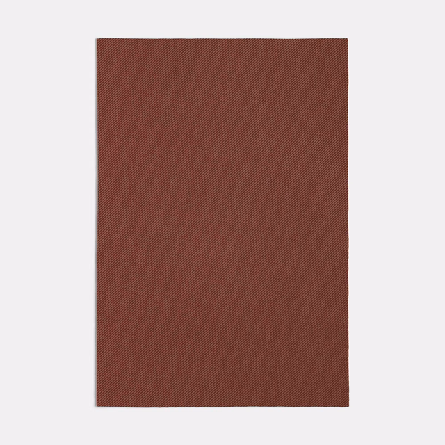 Deep russet-pink fabric swatch showing a fine, closely spaced diagonal weave