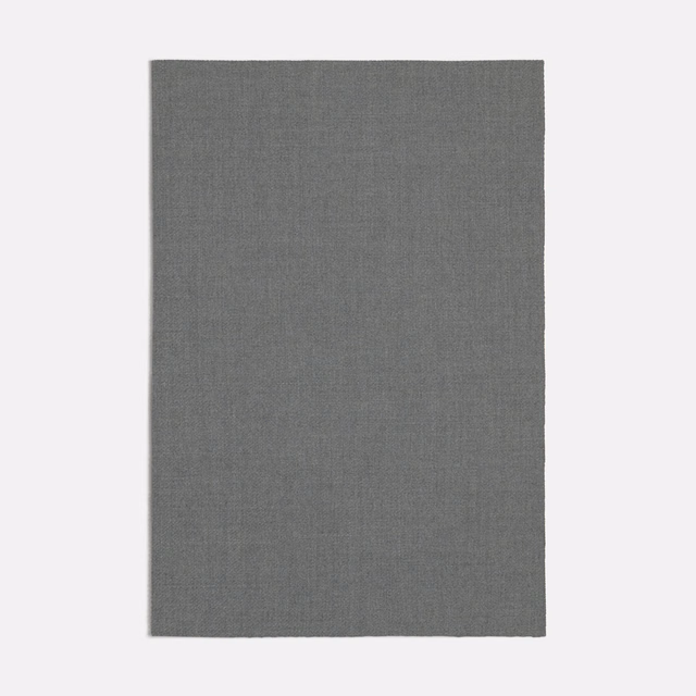 Close view of cool grey Garzato fabric with a fine, softly brushed weave.