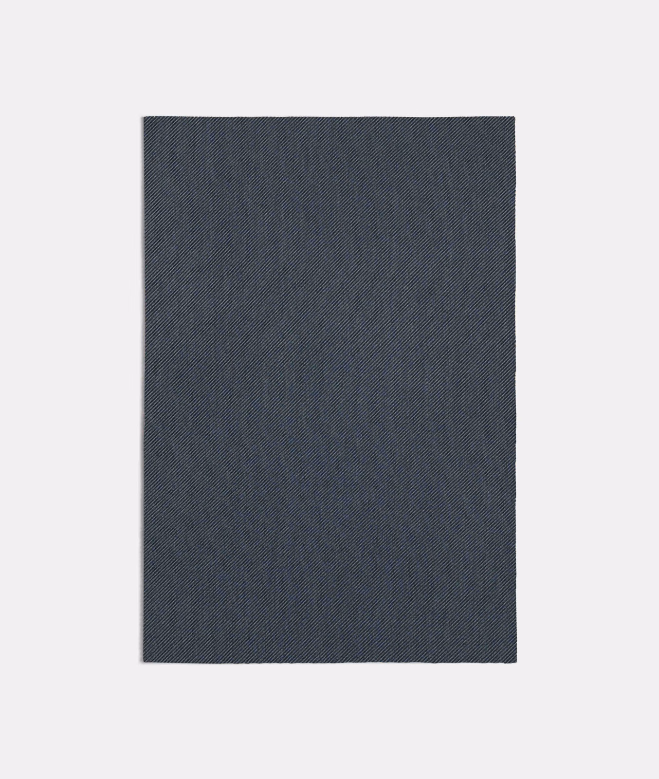 Deep jeans-blue swatch showing a fine, charcoal-toned diagonal woven texture
