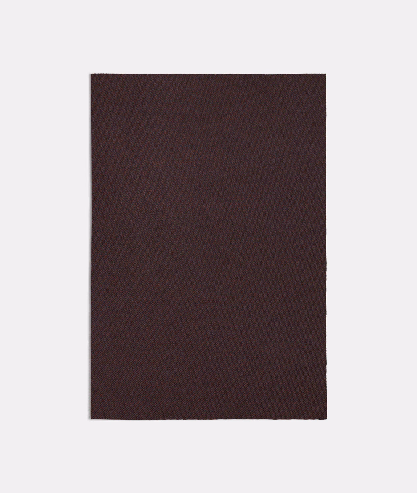 Near-black plum-purple swatch with a fine, barely visible woven texture