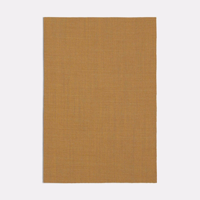 Warm salmon-brown woven swatch with a fine, even pin-grain texture