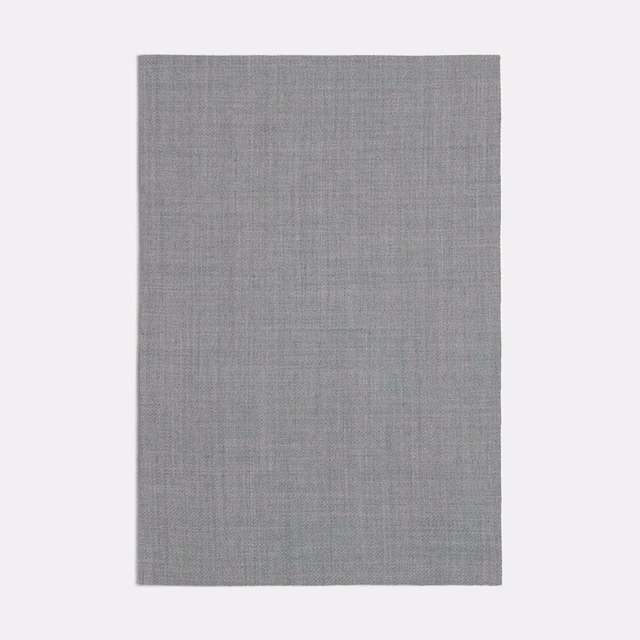 Cool taupe-grey fabric swatch showing a fine, subtly crosshatched woven texture