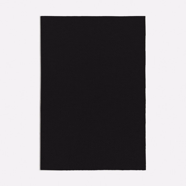 Near-black Ginostra swatch showing a compact, subtly textured woven surface